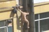 chinese-man-climbs-pipe-to-avoid-prostitution-arrest-06-560x373.jpg